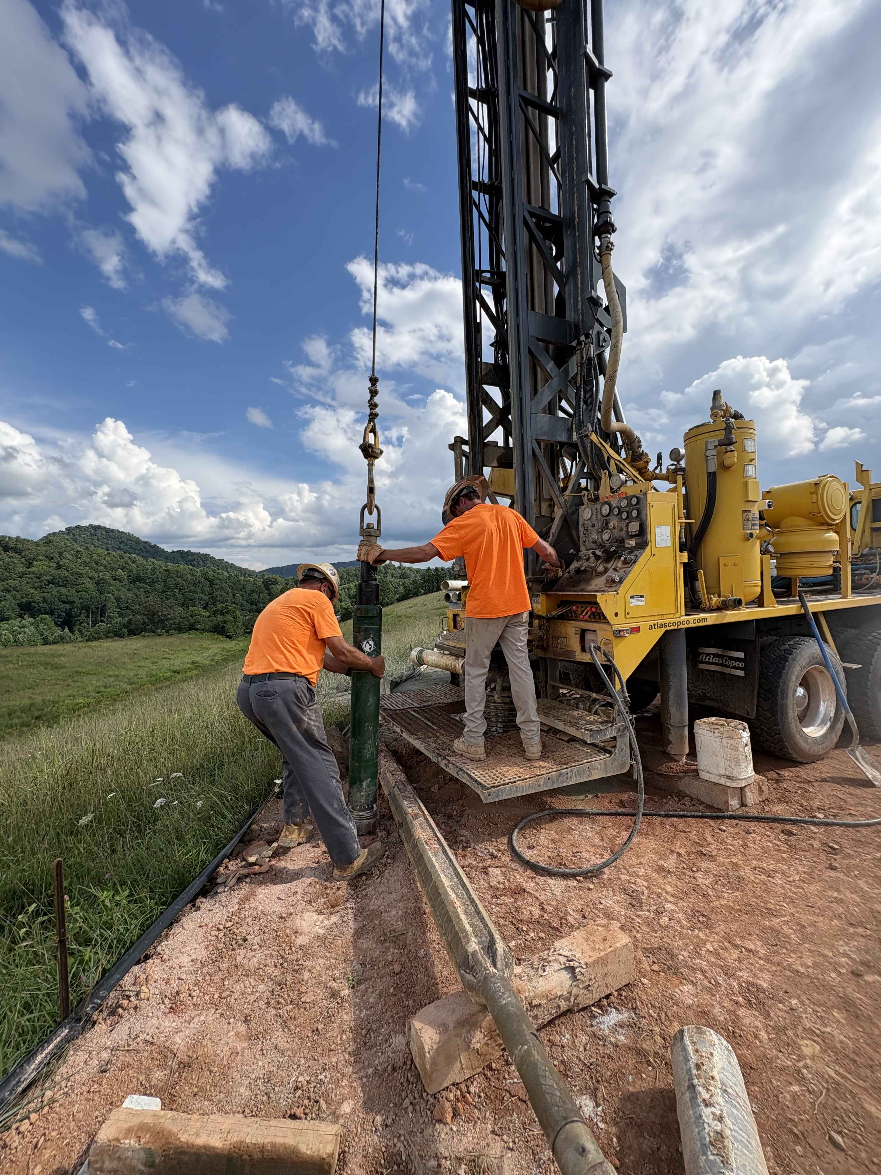 Drilling crew handling downhole tooling in the field